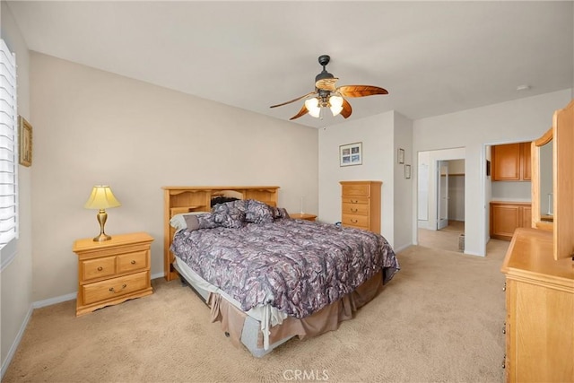 bedroom featuring light colored carpet, baseboards, and ceiling fan