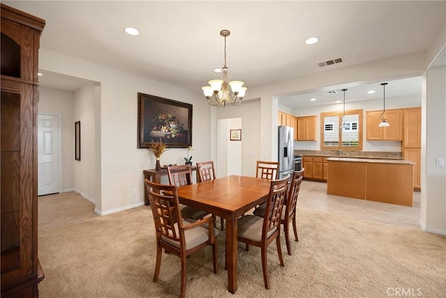 dining space with light carpet, visible vents, baseboards, a chandelier, and recessed lighting