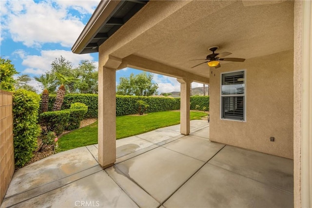 view of patio with a ceiling fan and a fenced backyard