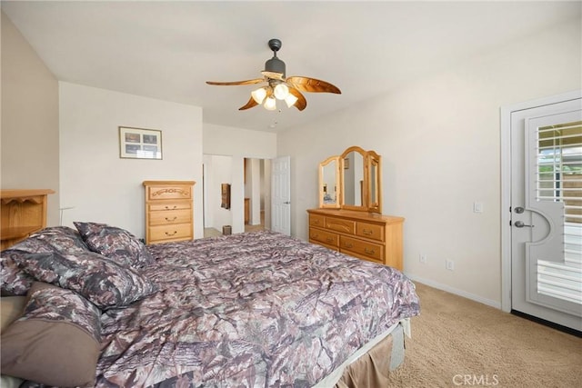 carpeted bedroom with baseboards and ceiling fan