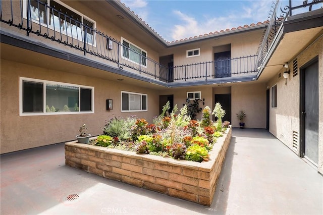 surrounding community featuring a patio
