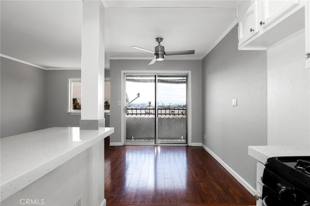 dining area with ceiling fan, baseboards, ornamental molding, and dark wood-style floors
