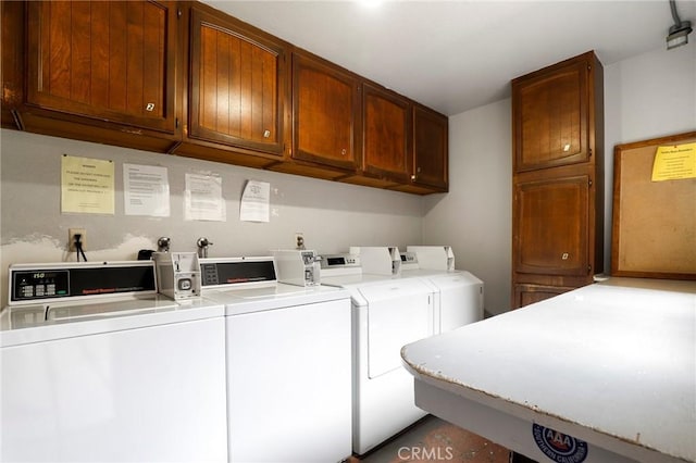 laundry area featuring washer and dryer and cabinet space