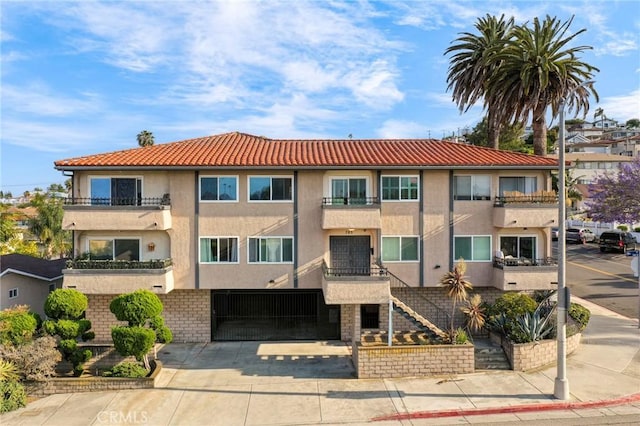 785 W 19th St Unit 10, San Pedro, CA 90731 - view of property featuring stairway and concrete driveway