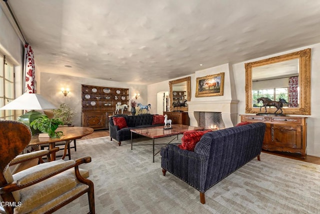 3325 Figueroa Mountain Rd, Los Olivos, CA 93441 - living area featuring a lit fireplace and wood finished floors