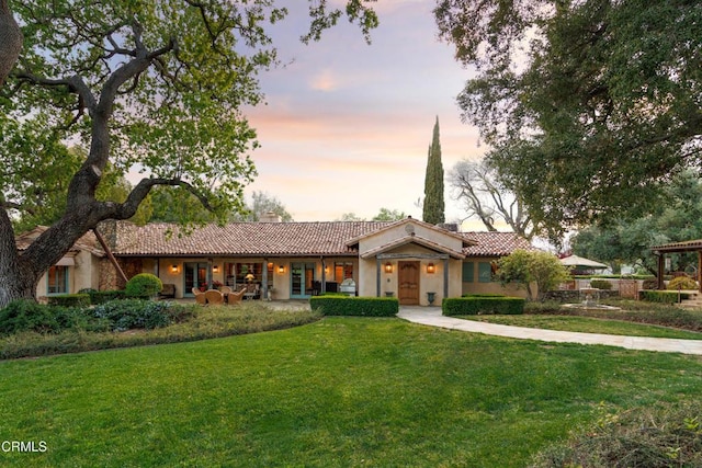 3325 Figueroa Mountain Rd, Los Olivos, CA 93441 - ranch-style house with a tile roof, a front lawn, a chimney, and french doors