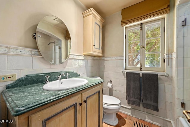3325 Figueroa Mountain Rd, Los Olivos, CA 93441 - bathroom featuring tile walls, vanity, toilet, tile patterned floors, and a wainscoted wall