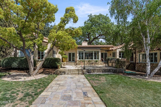 3325 Figueroa Mountain Rd, Los Olivos, CA 93441 - rear view of property featuring a chimney, stucco siding, a yard, area for grilling, and a patio area