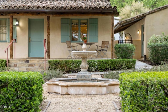 3325 Figueroa Mountain Rd, Los Olivos, CA 93441 - view of exterior entry featuring a tile roof and stucco siding
