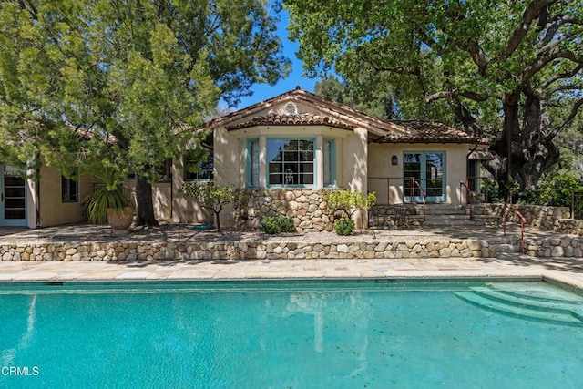 3325 Figueroa Mountain Rd, Los Olivos, CA 93441 - back of house featuring a patio, stucco siding, an outdoor pool, and a tile roof