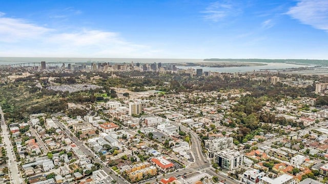 drone / aerial view with a city view and a water view