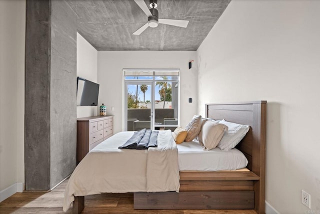 bedroom featuring a ceiling fan, baseboards, access to outside, and wood finished floors