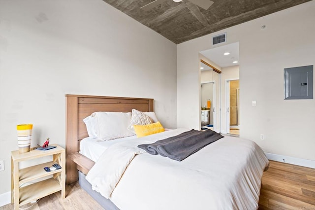 3740 Park Blvd Unit 209, San Diego, CA 92103 - bedroom featuring electric panel, wood finished floors, and baseboards