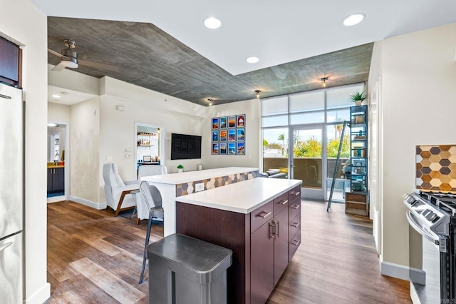 3740 Park Blvd Unit 209, San Diego, CA 92103 - kitchen with stainless steel appliances, open floor plan, dark wood-style flooring, light countertops, and recessed lighting