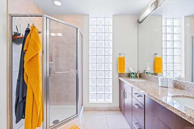 3740 Park Blvd Unit 209, San Diego, CA 92103 - bathroom featuring double vanity, a shower stall, and tile patterned flooring