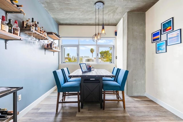 3740 Park Blvd Unit 209, San Diego, CA 92103 - dining area with wood finished floors and baseboards