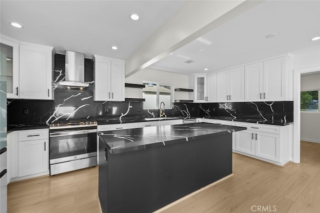 24431 La Glorita Cir, Newhall, CA 91321 - kitchen with stainless steel range with gas cooktop, plenty of natural light, open shelves, and wall chimney exhaust hood