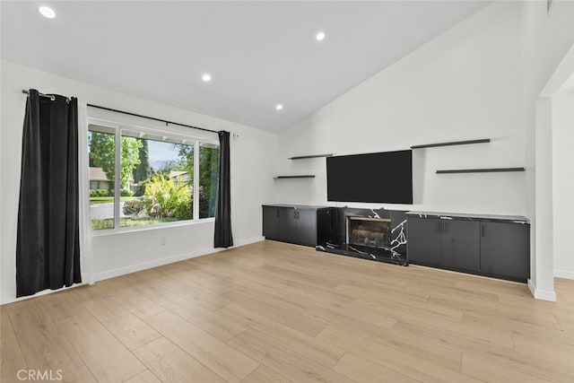24431 La Glorita Cir, Newhall, CA 91321 - living room with baseboards, light wood-style flooring, recessed lighting, and high vaulted ceiling