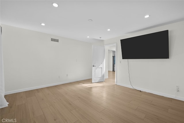 24431 La Glorita Cir, Newhall, CA 91321 - unfurnished living room featuring light wood-style flooring, baseboards, visible vents, and recessed lighting