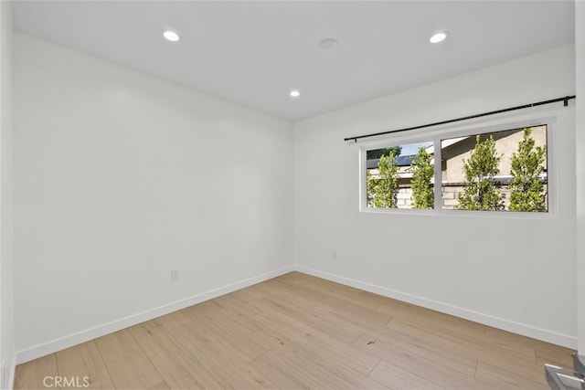 24431 La Glorita Cir, Newhall, CA 91321 - empty room featuring light wood finished floors, baseboards, and recessed lighting