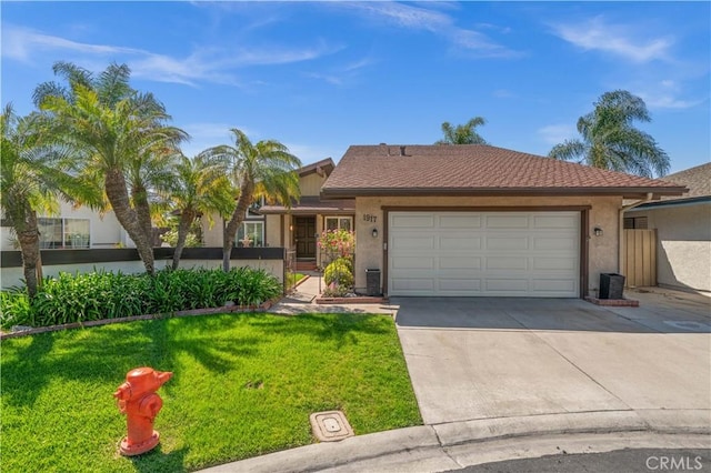 single story home featuring concrete driveway, an attached garage, stucco siding, and a front yard