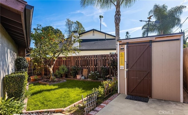 view of shed featuring a fenced backyard
