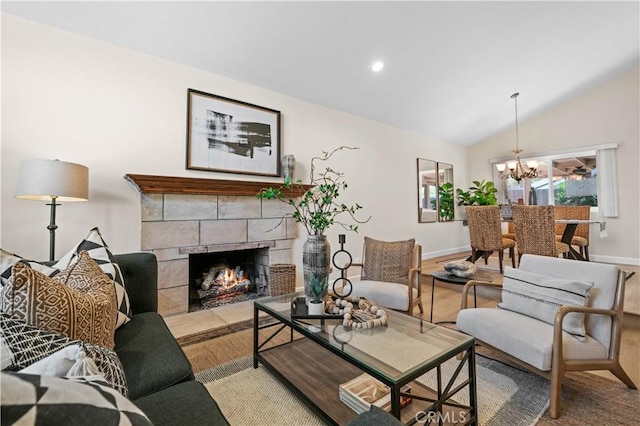 living area featuring baseboards, a chandelier, a warm lit fireplace, and lofted ceiling