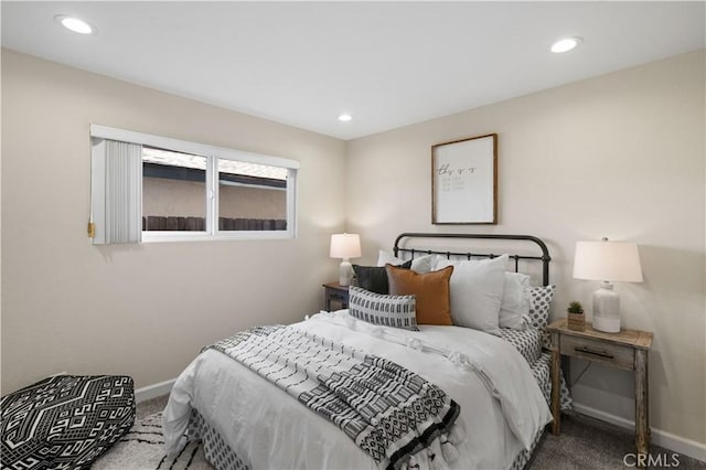 carpeted bedroom featuring baseboards and recessed lighting