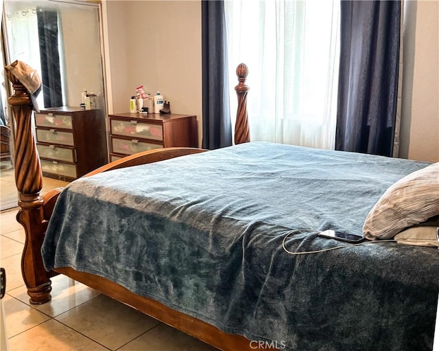 644 Whittendale St, Bakersfield, CA 93307 - bedroom with multiple windows and tile patterned flooring