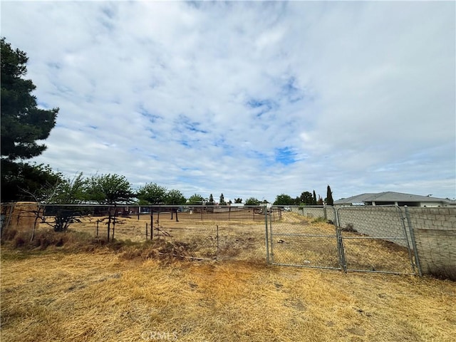 644 Whittendale St, Bakersfield, CA 93307 - view of yard with a rural view, a gate, and fence