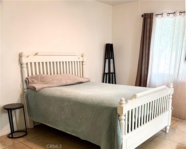 644 Whittendale St, Bakersfield, CA 93307 - bedroom with baseboards and tile patterned floors