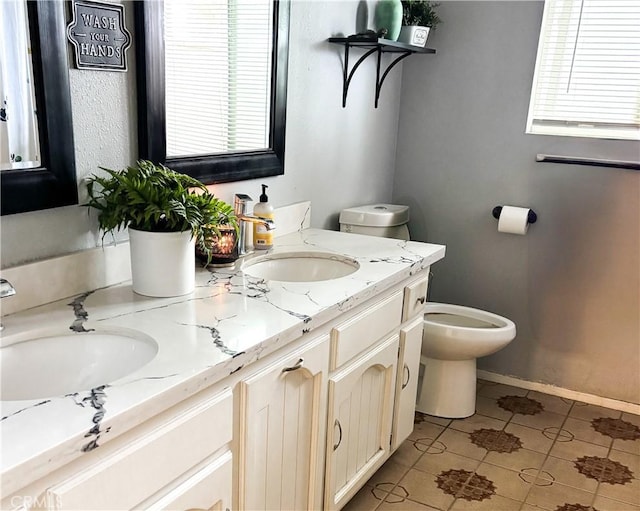 644 Whittendale St, Bakersfield, CA 93307 - full bathroom with tile patterned flooring, a healthy amount of sunlight, and a sink