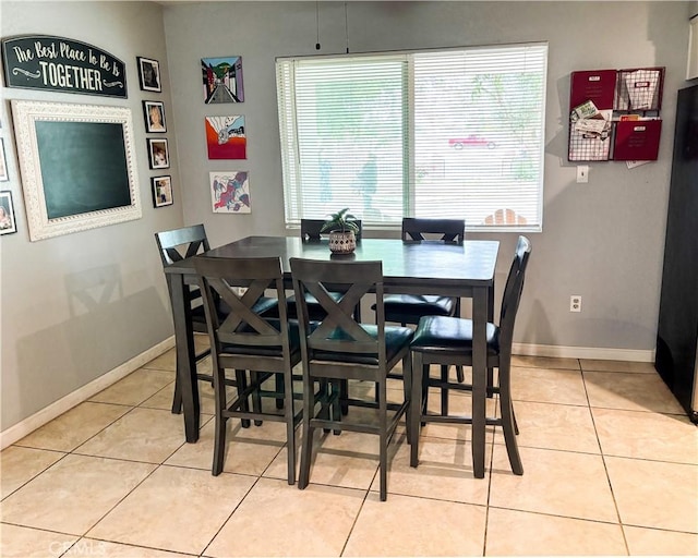 644 Whittendale St, Bakersfield, CA 93307 - dining room with light tile patterned flooring, a wealth of natural light, and baseboards