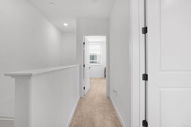 2152 Reed Dr, San Diego, CA 92154 - hallway with an upstairs landing, light carpet, baseboards, and recessed lighting