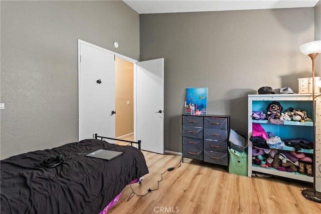 bedroom with wood finished floors