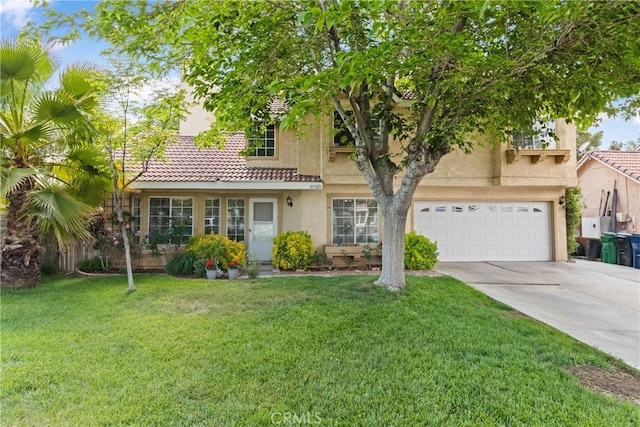 view of front of home featuring a garage, stucco siding, a tile roof, a front yard, and driveway