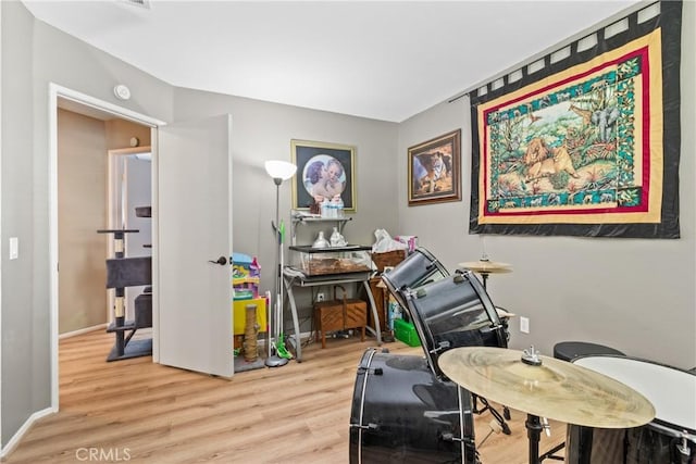 office with baseboards and wood finished floors