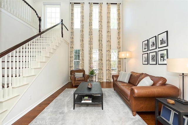 1472 Nicolas Way, Fullerton, CA 92833 - living area with a high ceiling, stairway, wood finished floors, and baseboards