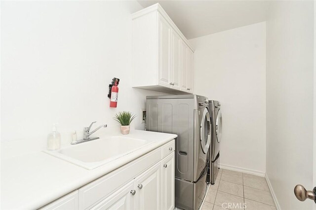 1472 Nicolas Way, Fullerton, CA 92833 - washroom with cabinet space, washer and dryer, light tile patterned floors, and baseboards