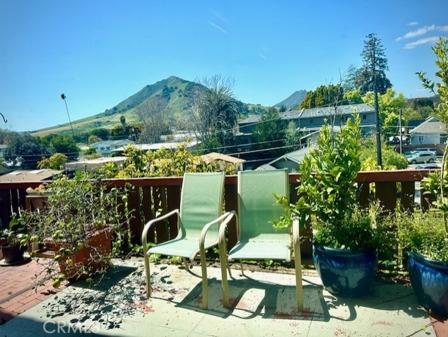 balcony featuring a patio and a mountain view