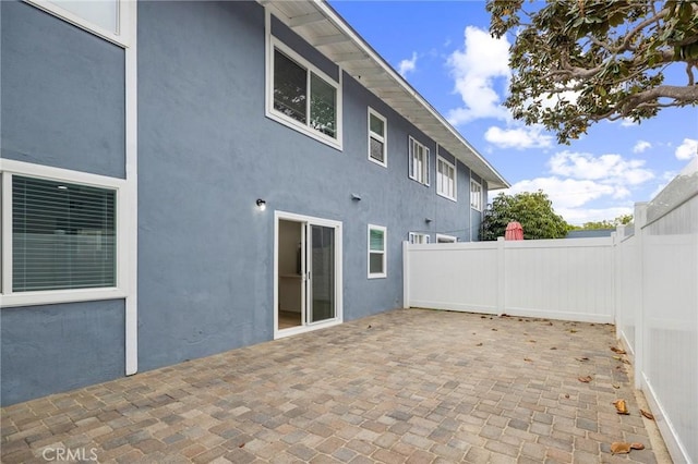 view of patio / terrace featuring fence