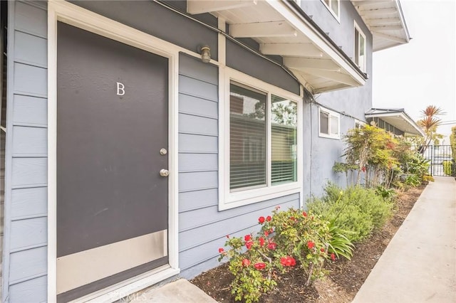 property entrance with fence