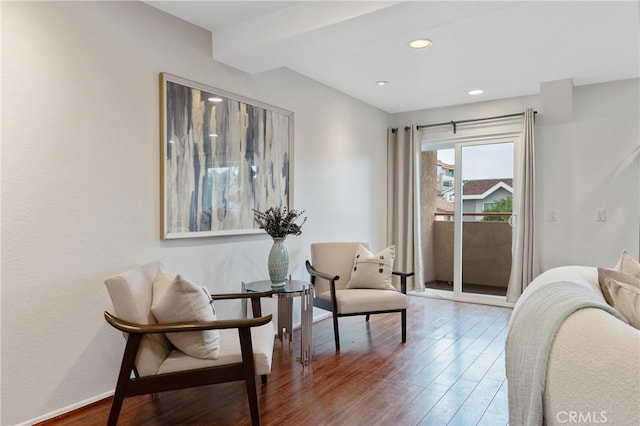 living area featuring baseboards, recessed lighting, and wood finished floors