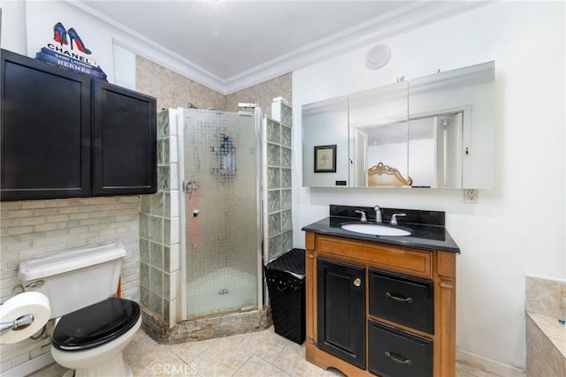 full bath featuring a shower stall, ornamental molding, vanity, and tile patterned flooring