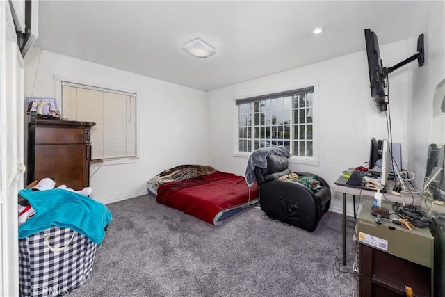 bedroom with carpet and baseboards