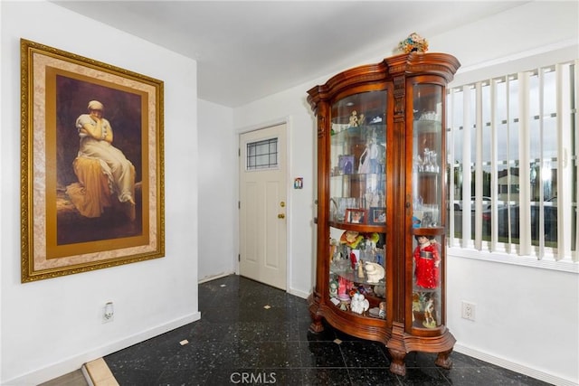 foyer entrance with baseboards