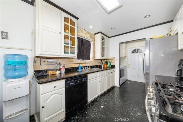 kitchen featuring dark countertops, glass insert cabinets, a sink, and dishwasher