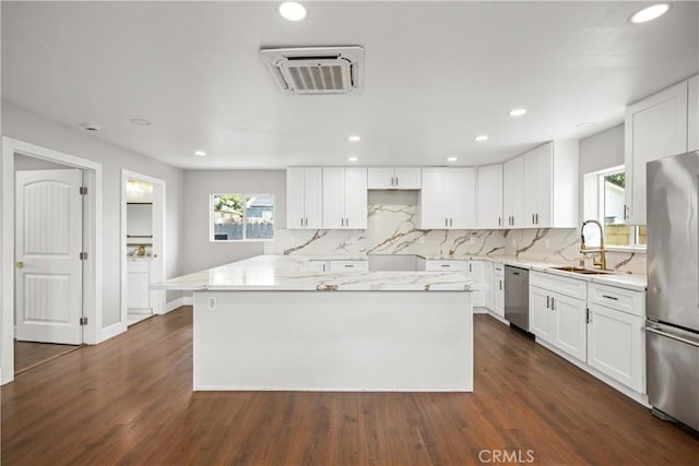 781 Sycamore Ct, Upland, CA 91786 - kitchen featuring appliances with stainless steel finishes, a sink, plenty of natural light, tasteful backsplash, and recessed lighting