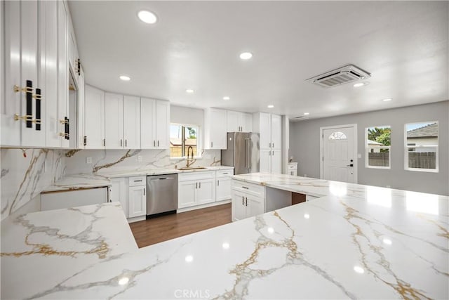 781 Sycamore Ct, Upland, CA 91786 - kitchen with appliances with stainless steel finishes, a sink, dark wood finished floors, white cabinetry, and recessed lighting