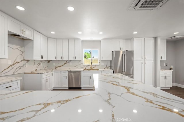 781 Sycamore Ct, Upland, CA 91786 - kitchen with appliances with stainless steel finishes, recessed lighting, light stone countertops, tasteful backsplash, and white cabinets